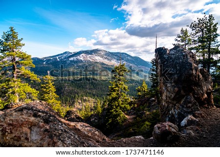 Gorgeous wide valley with Mountains and Spring Snow leading down into Emerald Bay of Lake Tahoe California during gorgeous morning sunshine 