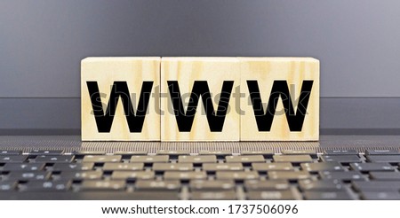 The word www is written on wooden cubes on a keyboard.