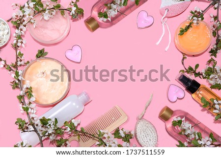 Spa ingredients, a set of cosmetic oils and cosmetics for skin and body care on a pink background. Shopping concept and modern woman, sale, top view, selective focus