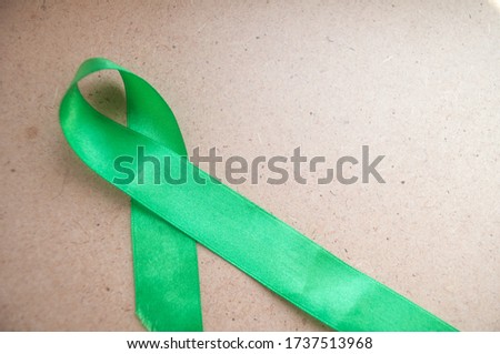 green ribbon awareness, mental health and lymphoma, World Mental Health Day. The problem of cerebral palsy, organ transplantation. Organ donations. Kidney cancer