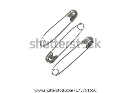 Small group of safety pins isolated on white background