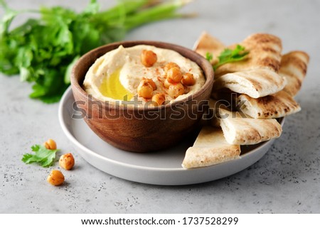 Hummus plate with pita bread. Middle Eastern traditional appetiser. Authentic arab cuisine Royalty-Free Stock Photo #1737528299