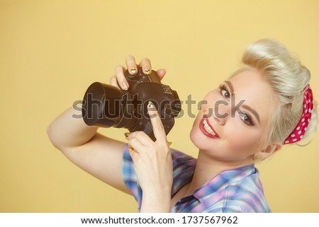 A photo of the pin-up girl with a photo camera