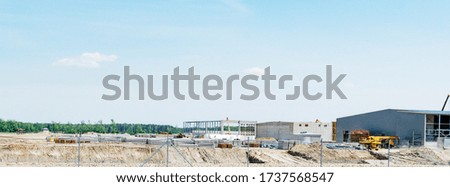 Large construction site of a new production in an open field