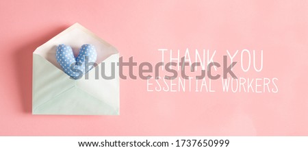 Thank You Essential Workers message with a blue heart cushion in an envelope