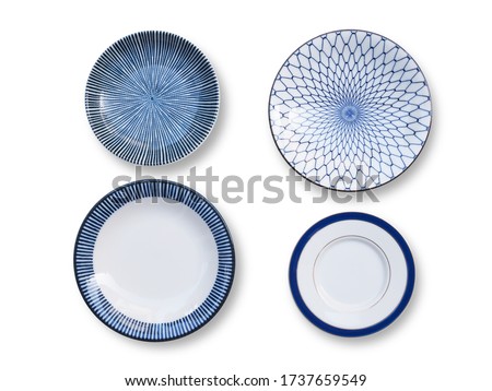 Top view of round ceramic plate set, tableware blue dish isolated on white background. Royalty-Free Stock Photo #1737659549
