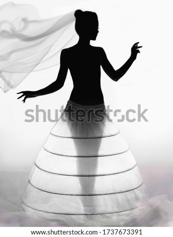 silhouette of a girl in a wedding dress