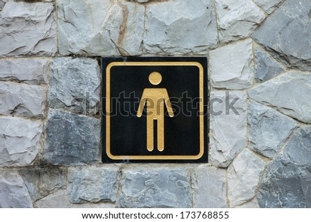 Toilet sign on wall