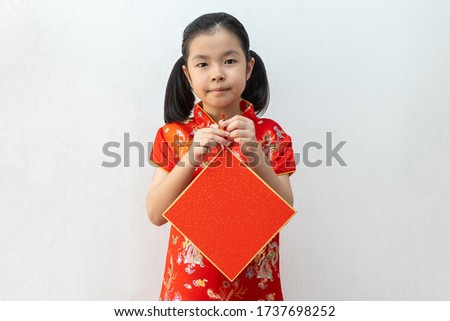 Asian girl wear cheongsam and holding blank rep paper