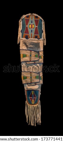 Native American papoose cradleboard isolated on black background. Clipping path.