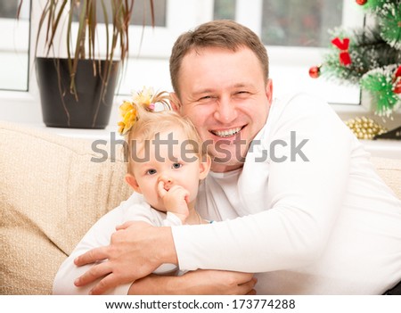Happy father and child girl hugging and laughing on isolated white background. Use it for baby, parenting or  family concept