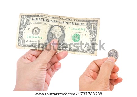 One dollar in hand and Thai Baht Coins (one baht ) in hand  Isolated on white background, Old one dollar banknote, saving money concept, banking or donation