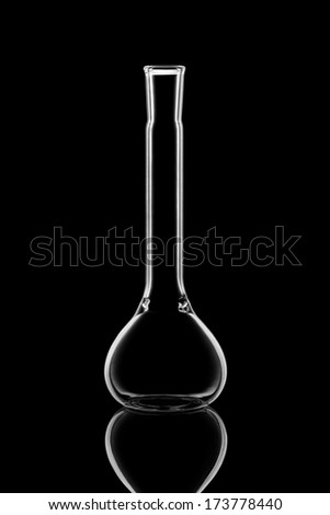 Empty chemistry flask on black