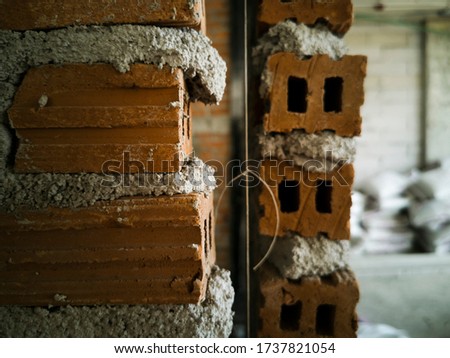 brick with messy mortar in constrcution site, photo is Depth of Field style