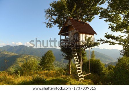 tree house in the mountains, a children's treehouse Royalty-Free Stock Photo #1737839315