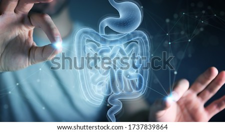 Man on dark background using digital x-ray of human intestine holographic scan projection 3D rendering Royalty-Free Stock Photo #1737839864