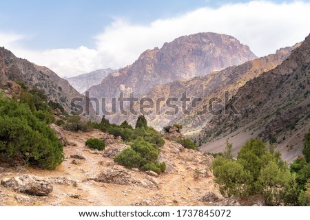The beautiful view of blue sky and snow mountain summit near to Kaltsit peak in Fann mountains in Tajikistan