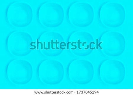 Blue plates on a blue background.