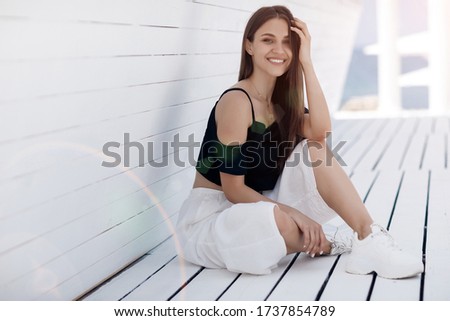 Close up shot of a beautiful young smiling woman outdoor