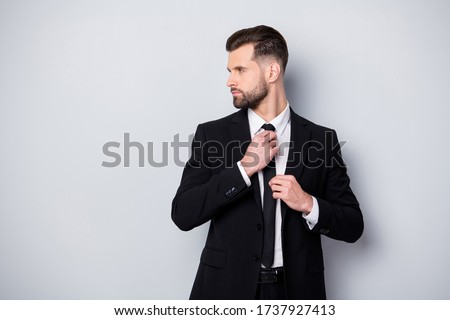 Profile side photo of masculine gentleman worker man adjust his tie prepare for business meeting with partners look copyspace wear classy outfit isolated over grey color background