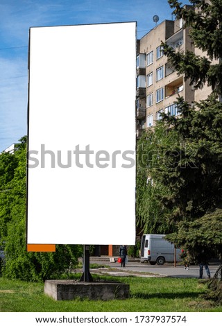 Blank billboard mockup with copy space in the city. Empty banner for advertisement. Large white screen for your text
