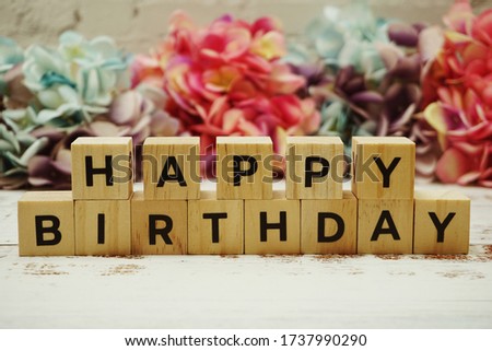 Happy Birthday alphabet letter on wooden background