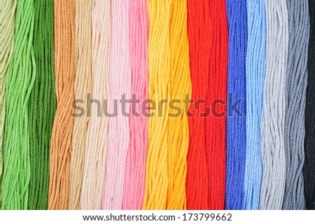 Colorful embroidery threads in a row. Colorful background.