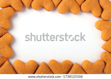 Heart cookies laid out in the form of a frame on a white background. Concept for Valentine's day or Good morning.