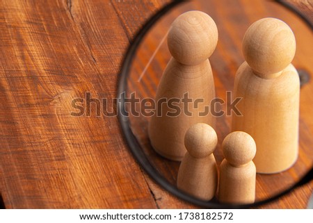 Small wooden figures of family members. Family relationship symbol