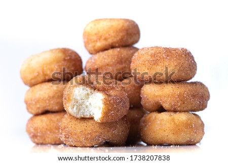 Cinnamon Sugar Mini Donuts in a stack on white background  Royalty-Free Stock Photo #1738207838