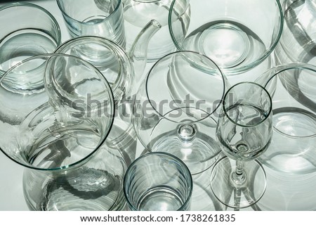 Different types of glassware are on a white surface.
