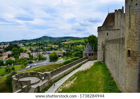 Old castle with high towers, historical fortress with walls and moat, knight's castle of king and queen 