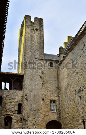 Old castle with high towers, historical fortress with walls and moat, knight's castle of king and queen 