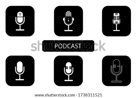 Set of Podcast logos. The white microphone icon in flat style on black background. Logo, application, user interface. Podcast radio icon. Studio table microphones.