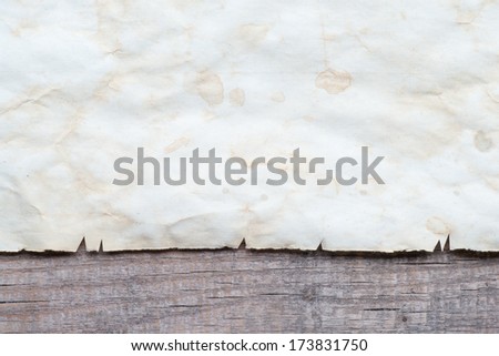 Vintage background with old paper on wooden background 