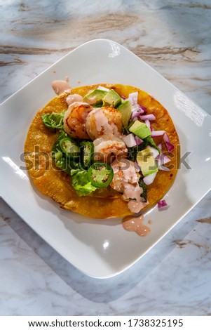 Mexican shrimp tostada flat tacos with orange chipotle sauce