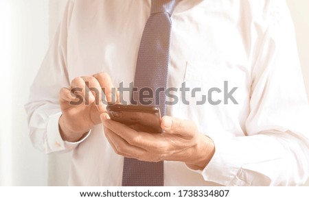 close up male hands of a businessman holding using texting phone. searching for information use internet. connecting people concept