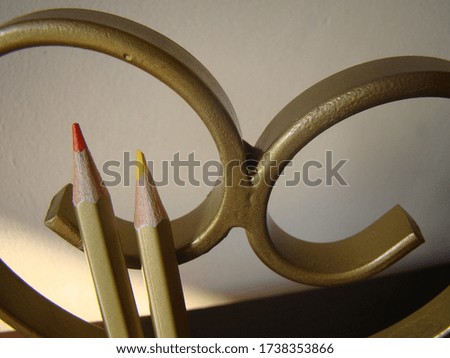 Gold pencils with a heart