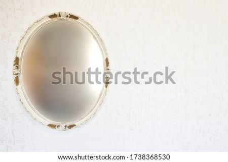 Antique vintage blurred mirror on wall with wallpaper, retro vintage design space for text moody
