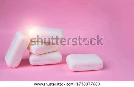 Soap on pink background. Picture with selective focus and place for text. Concept of maintaining cleanliness and personal hygiene
