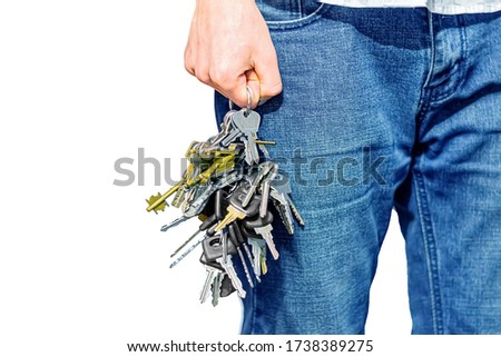 big bunch of keys in my jeans hand Royalty-Free Stock Photo #1738389275