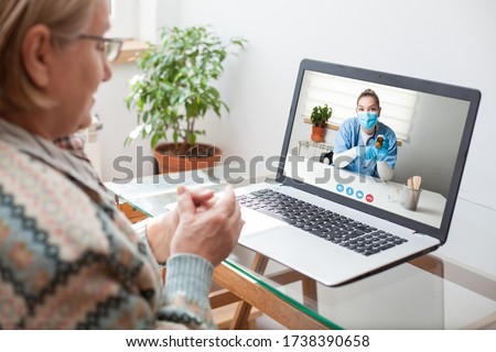 Young female doctor consulting with elderly woman over video help line virtual medical appointment chat,GP prescribing medication to senior patient,telemedicine diagnosis,therapy and treatment concept Royalty-Free Stock Photo #1738390658