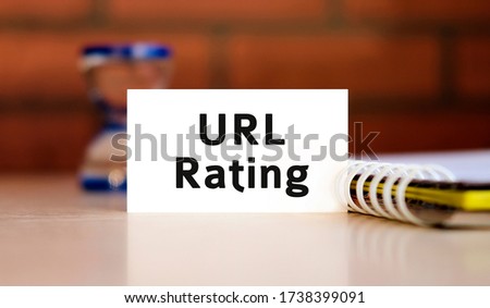 Url rating - text n white sheet with notepad and hourglass