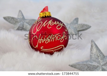 Christmas decorations red and silver on fake fur snow stock, photo, photograph Christmas Red silver decorations bauble sparkle glitter Christmas decoration with fluffy fake snow made of white fur