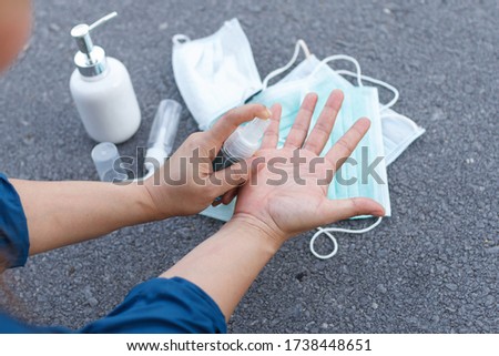 The woman use alcohol to clean hands for prevention of coronavirus virus outbreak. COIVD 19 Royalty-Free Stock Photo #1738448651