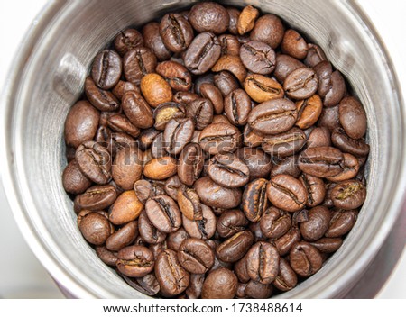 Closeup picture of coffee bean grinder and coffee bean