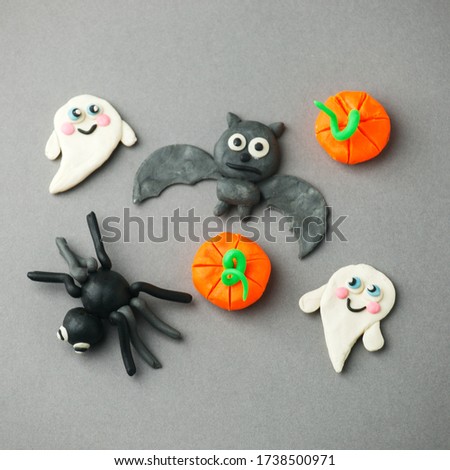 Handmade plasticine set for seasonal holiday Halloween and autumn days -  ghost, pumpkin, spider and bat, creative DIY idea for kids