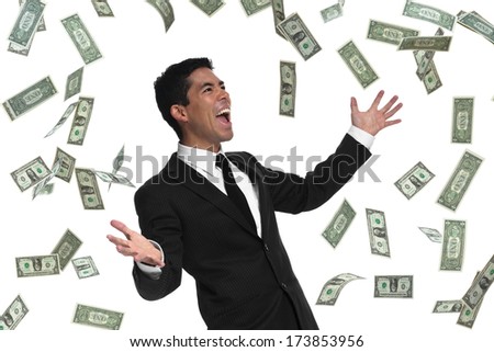 Raining money on a businessman holding his hands out looking to the side