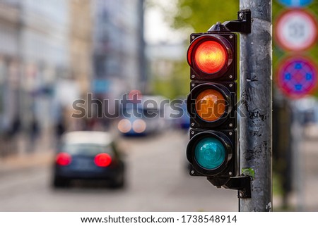 a city crossing with a semaphore, red light in semaphore, traffic control and regulation concept Royalty-Free Stock Photo #1738548914