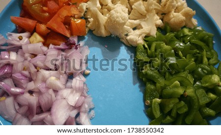 
Fresh sliced and chopped vegetables ingredients of salad, concept of healthy dish.